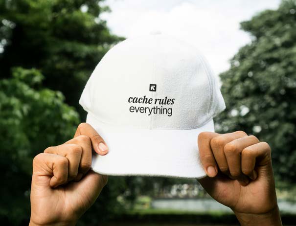 White cap with 'cache rules everything' and Inkline logomark