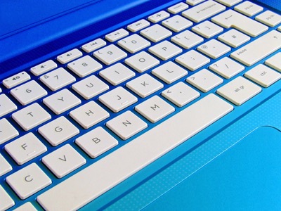Blue laptop keyboard close up