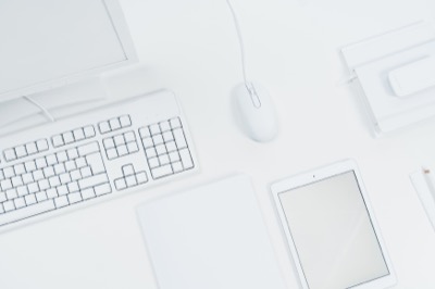 Clean white desk computer tablet